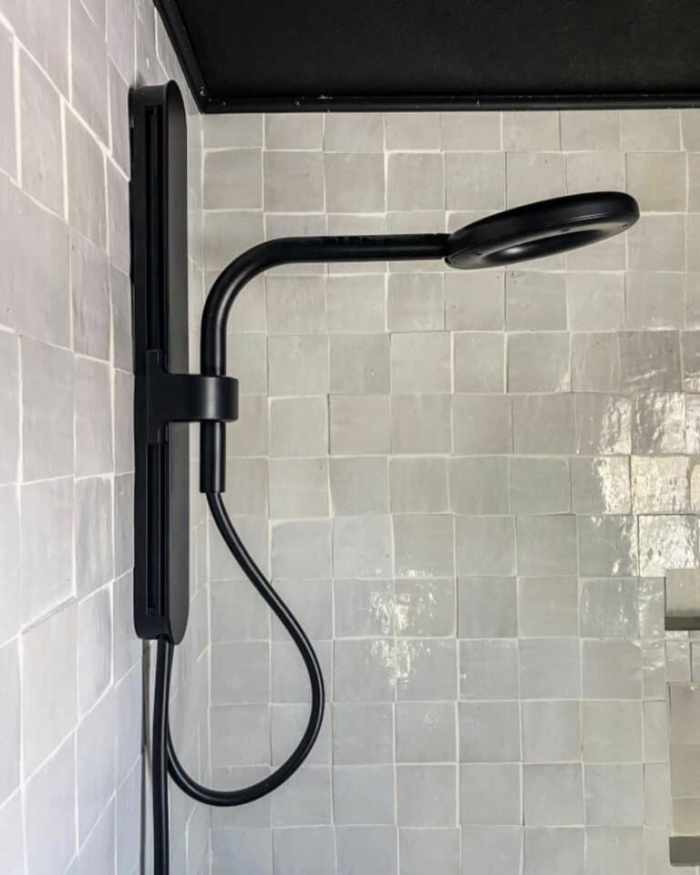 A Modern Spa Shower With Square Gray Tiles