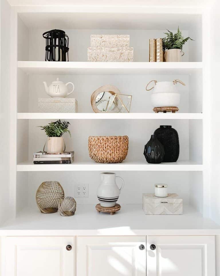 Adding Black Modern Decorations to a White Bookshelf