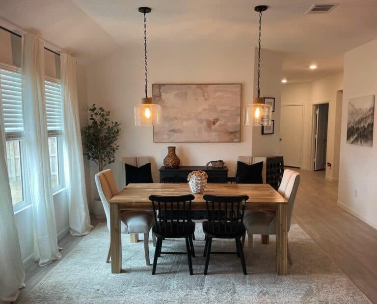Artistic Dining Room With Pendant Lighting
