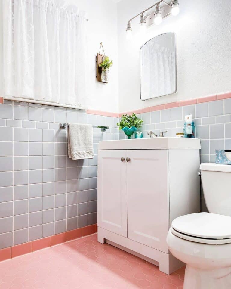 Bathroom Half Wall With Pink Tile Flooring