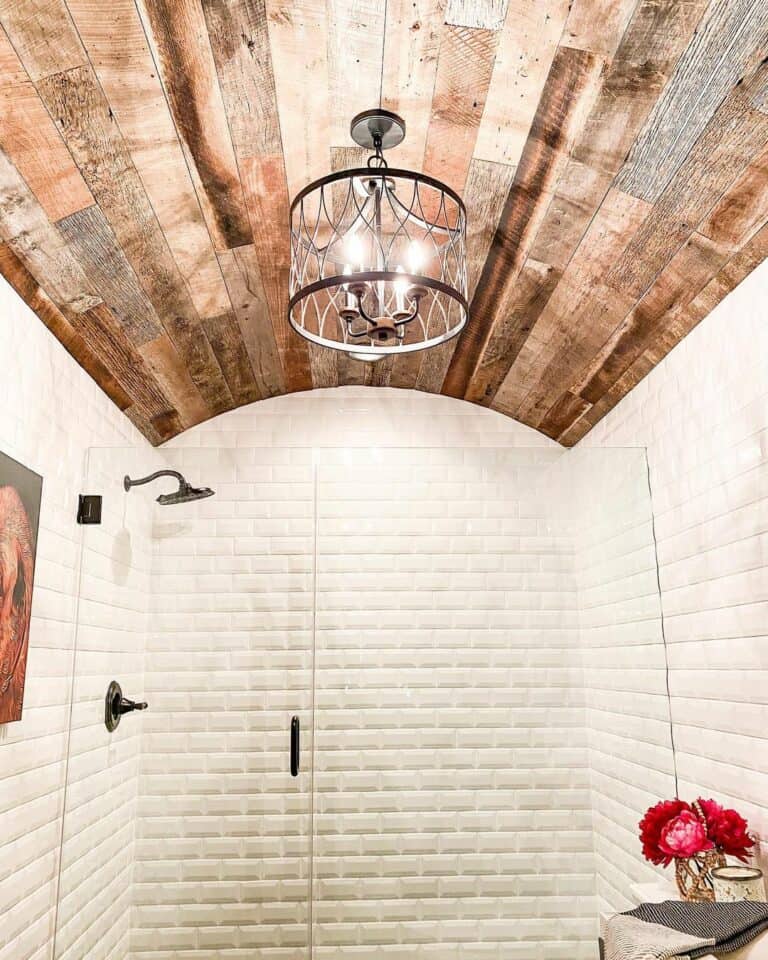 Bathroom With Beige-tiled Wall and Wooden Ceiling