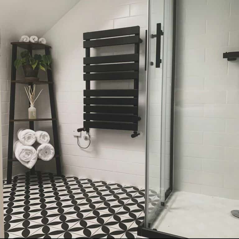 Bathroom With Black-and-White Geometric-patterned Floor Tiles