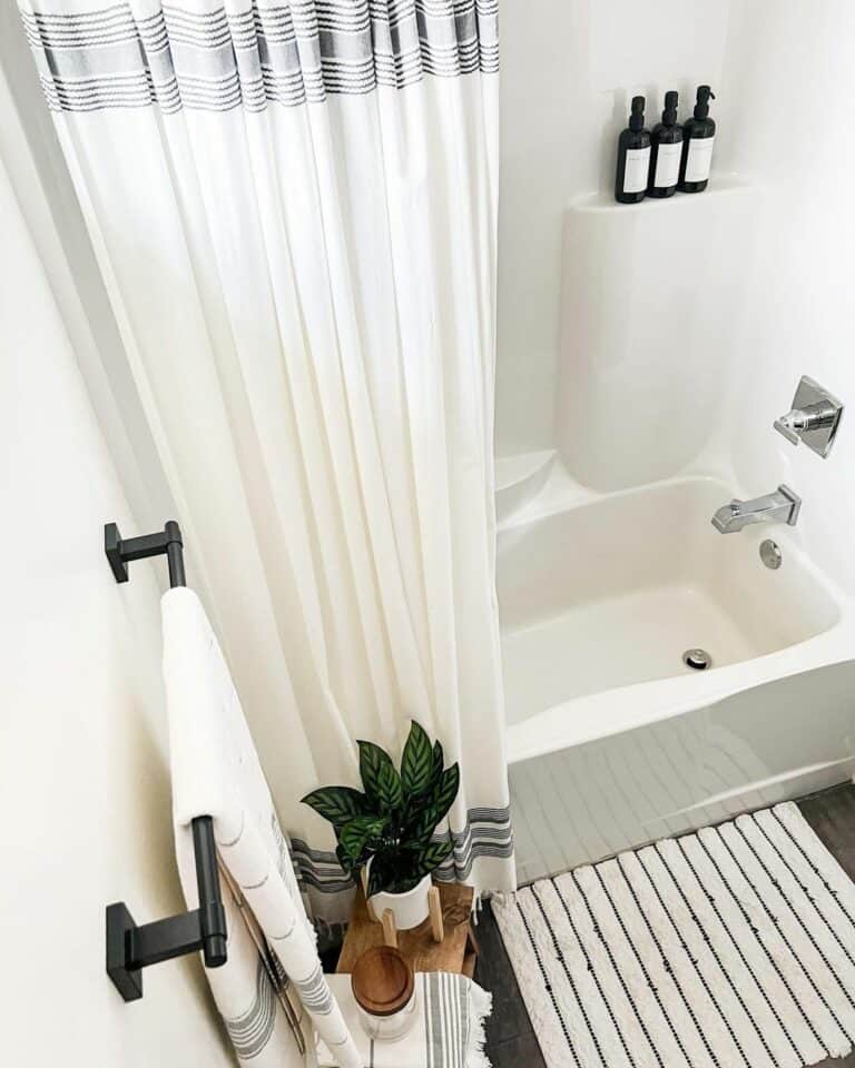 Bathroom With White and Gray Shower Curtain