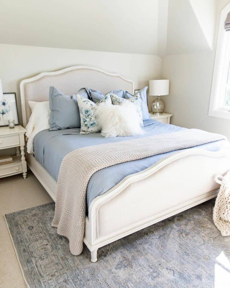 Bedroom With Blue Pillows and Mattress