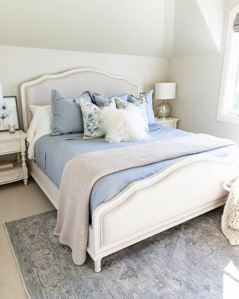 Bedroom With Blue Pillows and Mattress