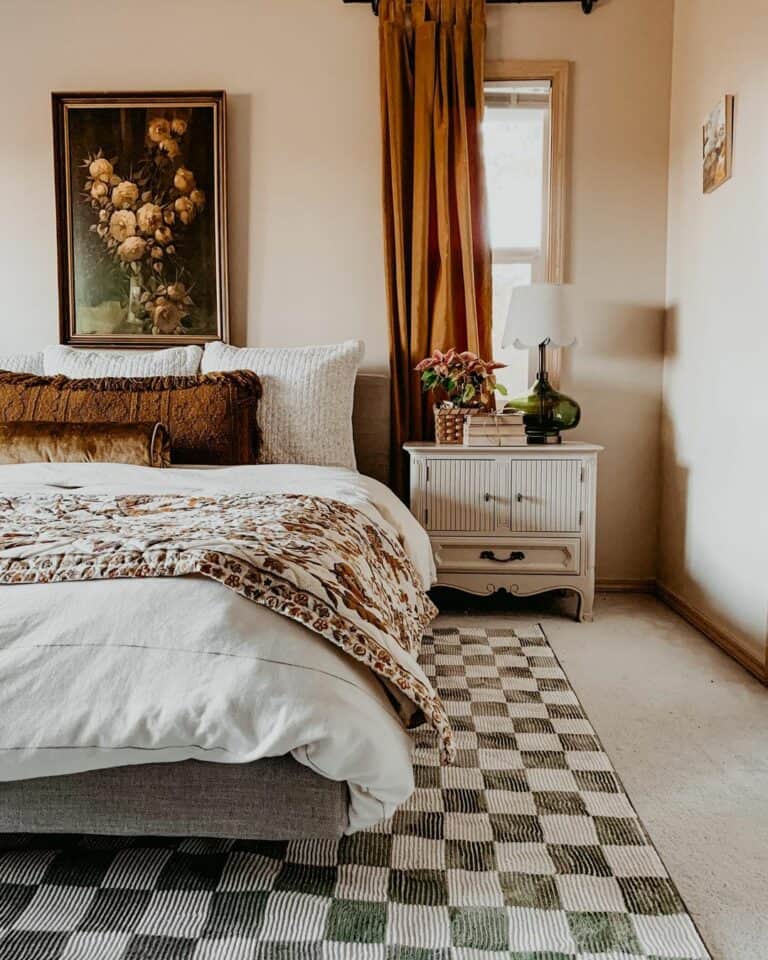 Bedroom With Gold Framed Artwork Above Bed