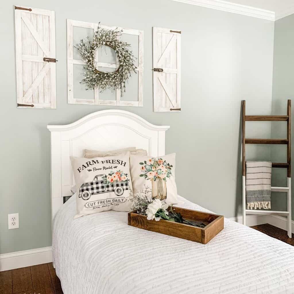 Bedroom With Pastel-green Walls and Farmhouse-inspired Frames