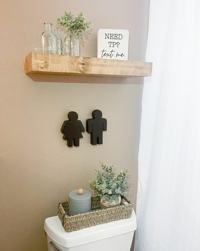 Beige Bathroom With Silhouette Ornaments