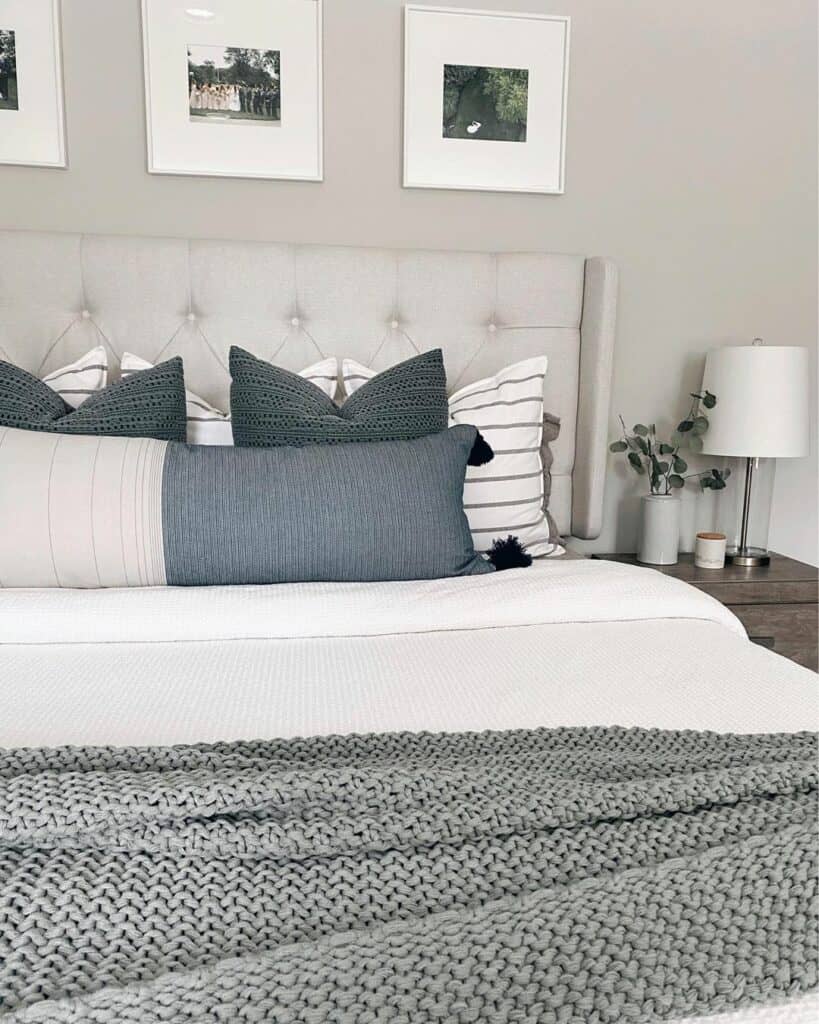 Beige Bed With Gray Knit Throw