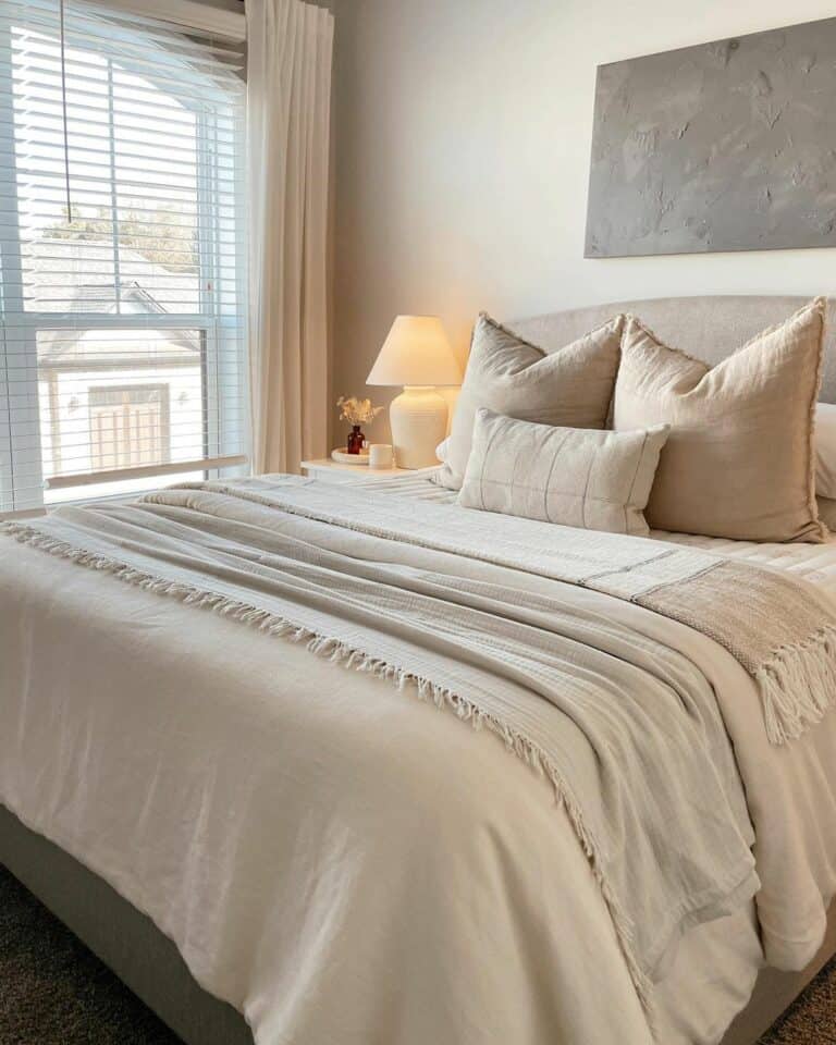 Beige Bed With Modern Gray Painting