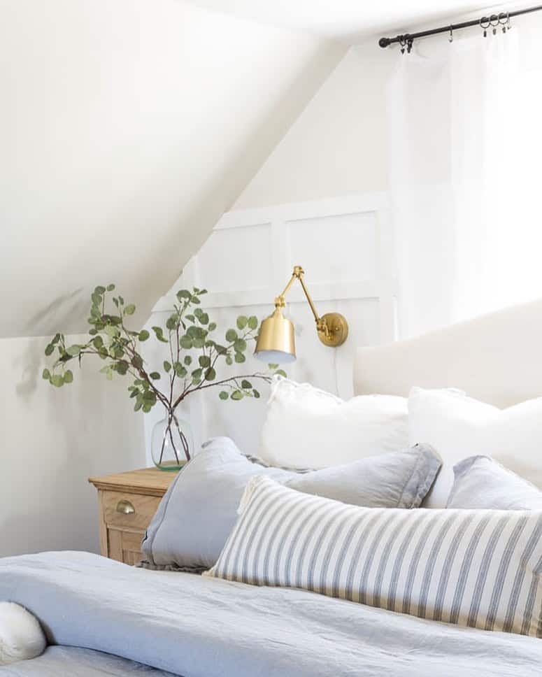 Beige Bed With White and Blue Bedding