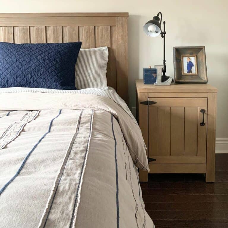 Beige Bedding With a Dark Navy Pillow