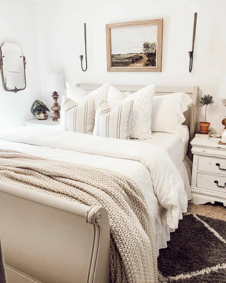 Beige Sleigh Bed Sits on Layered Carpet