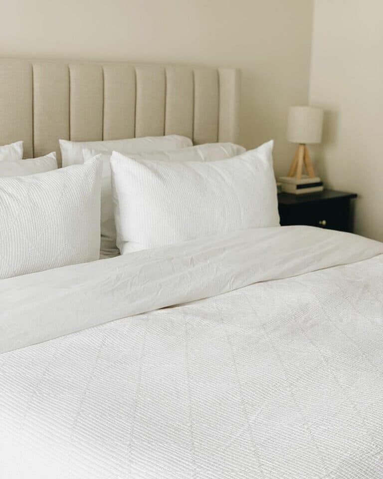 Beige Tufted Bed With White Bedding