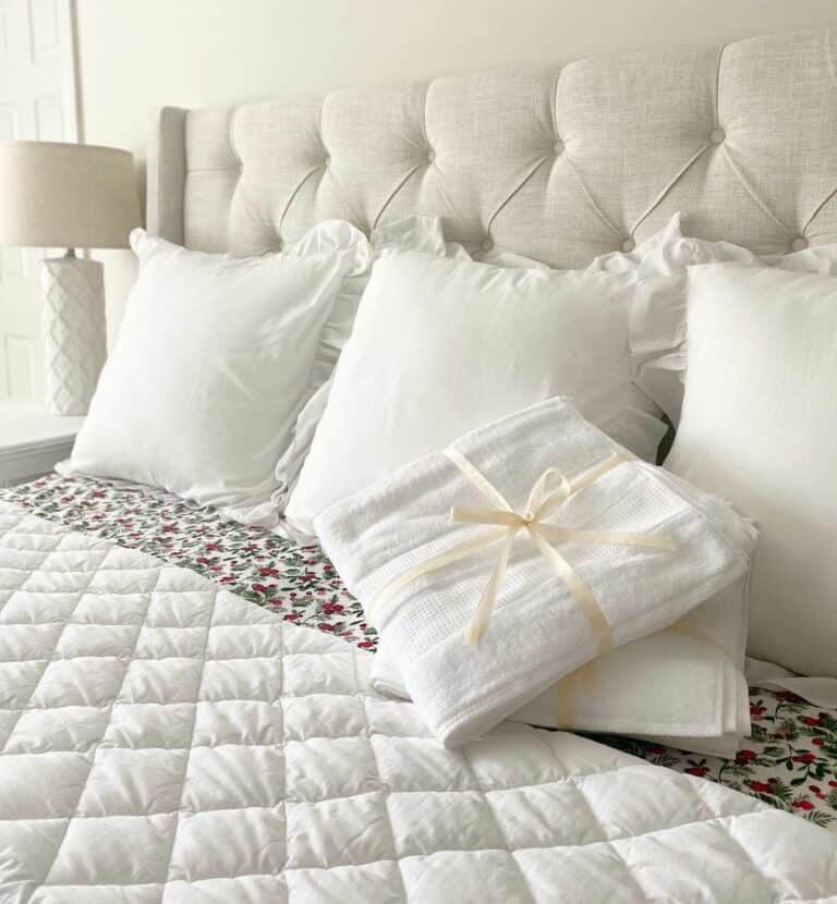 Beige Tufted Guest Bed With White Bedding
