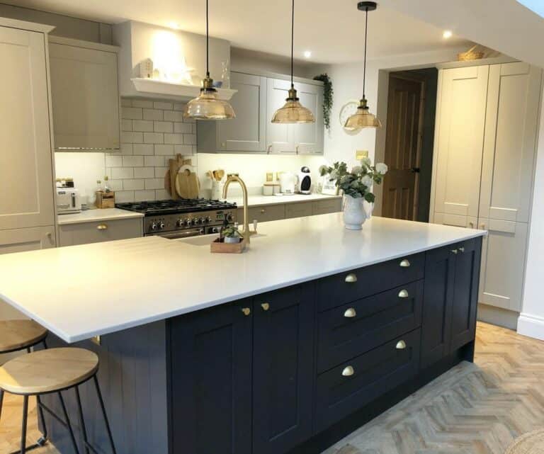 Black Cabinets and a Light Wood Herringbone Floor