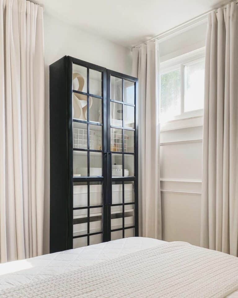 Black Display Cabinet and Long Linen Curtains