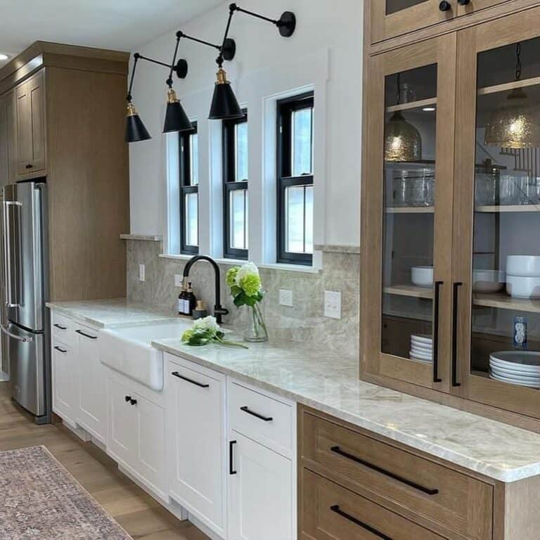 Black Sconces Mounted Over Kitchen Windows