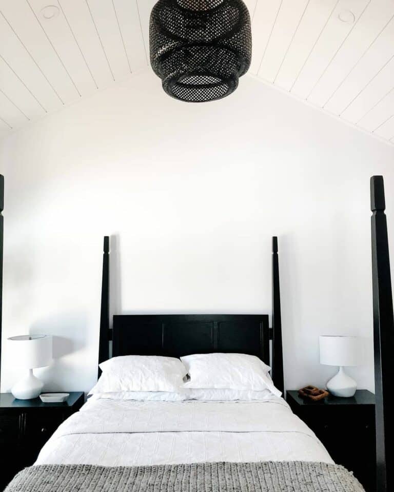 Black and White Bedroom With Black Rattan Chandelier