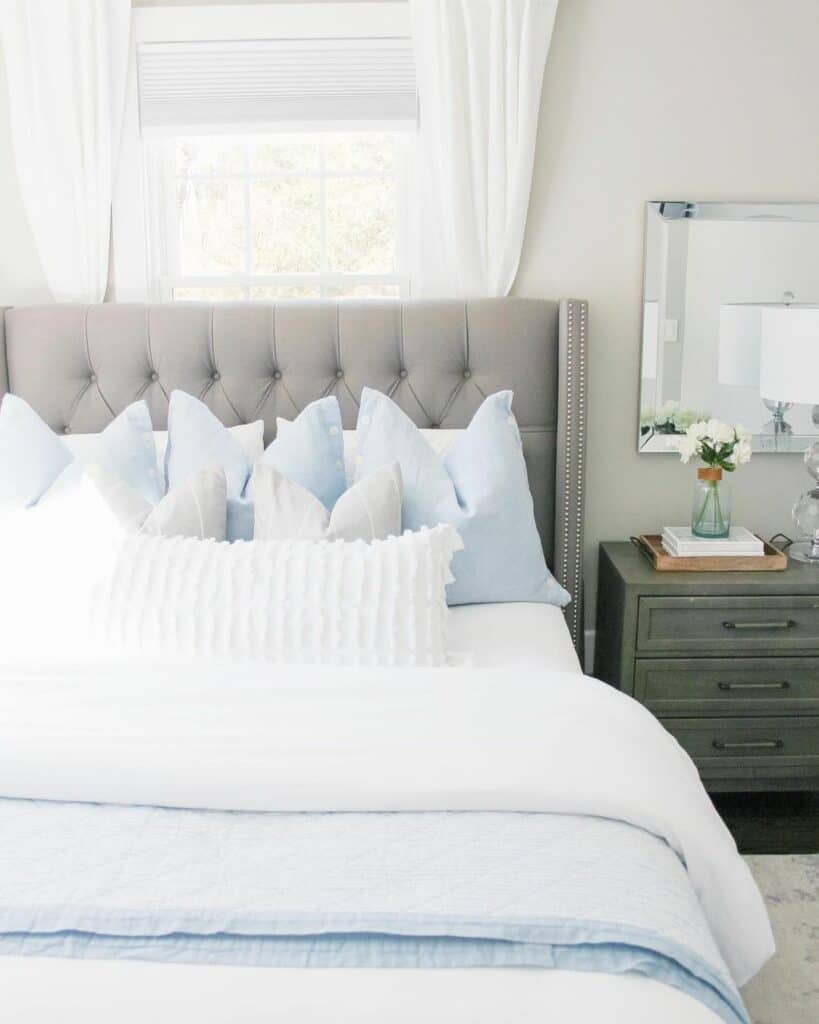 Blue and White Cottage Bedroom With White Flowers