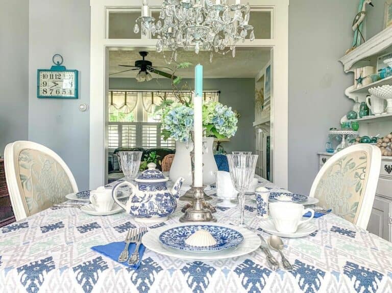 Blue and White Dining Room With Glass Chandelier