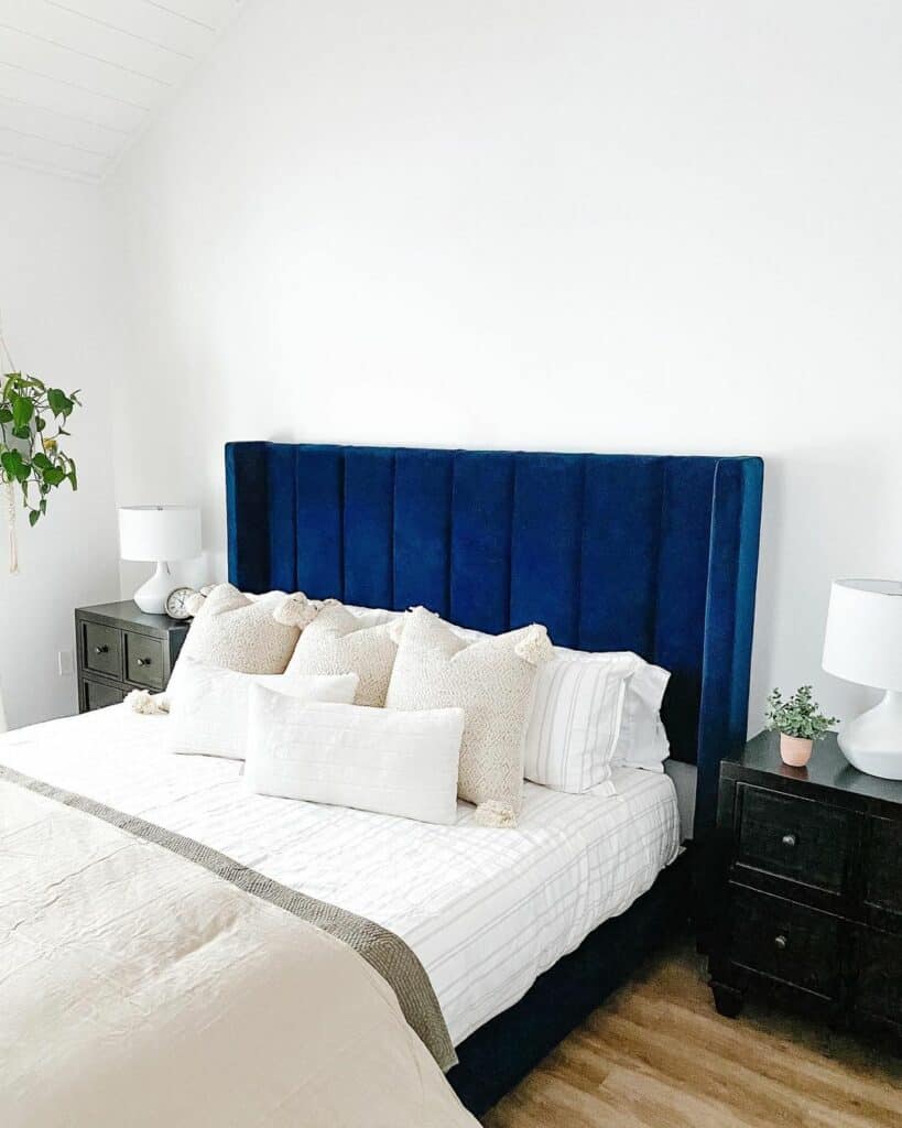 Blue and White-themed Bedroom With White Lamps