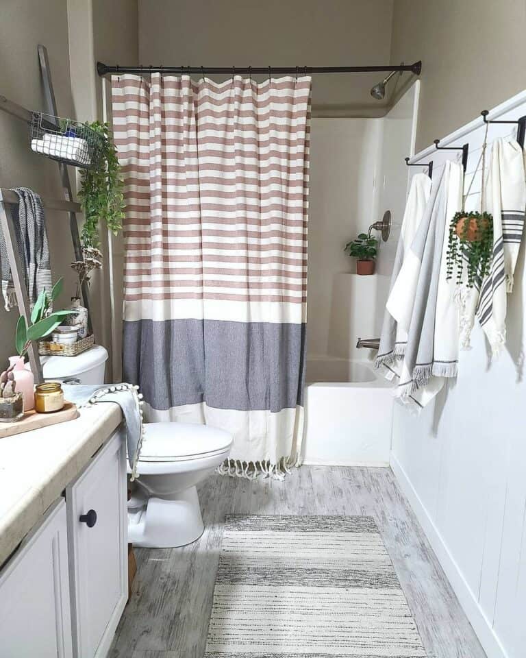 Boho Bathroom Featuring a Tasseled Shower Curtain