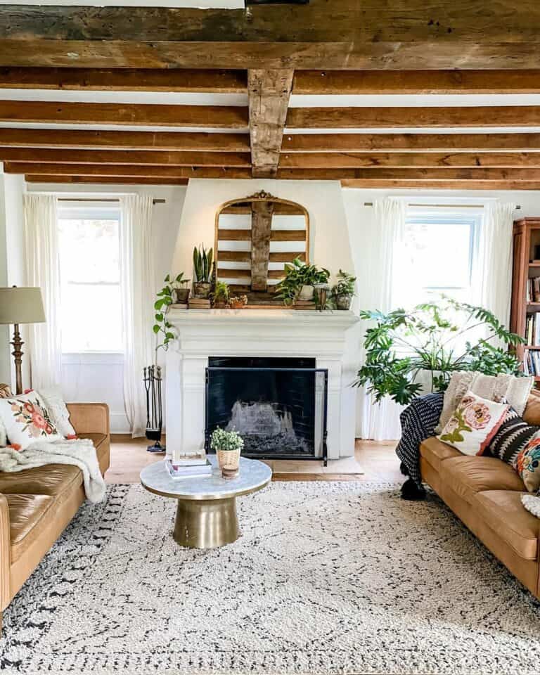Boho Living Room With Two Tan Leather Sofas