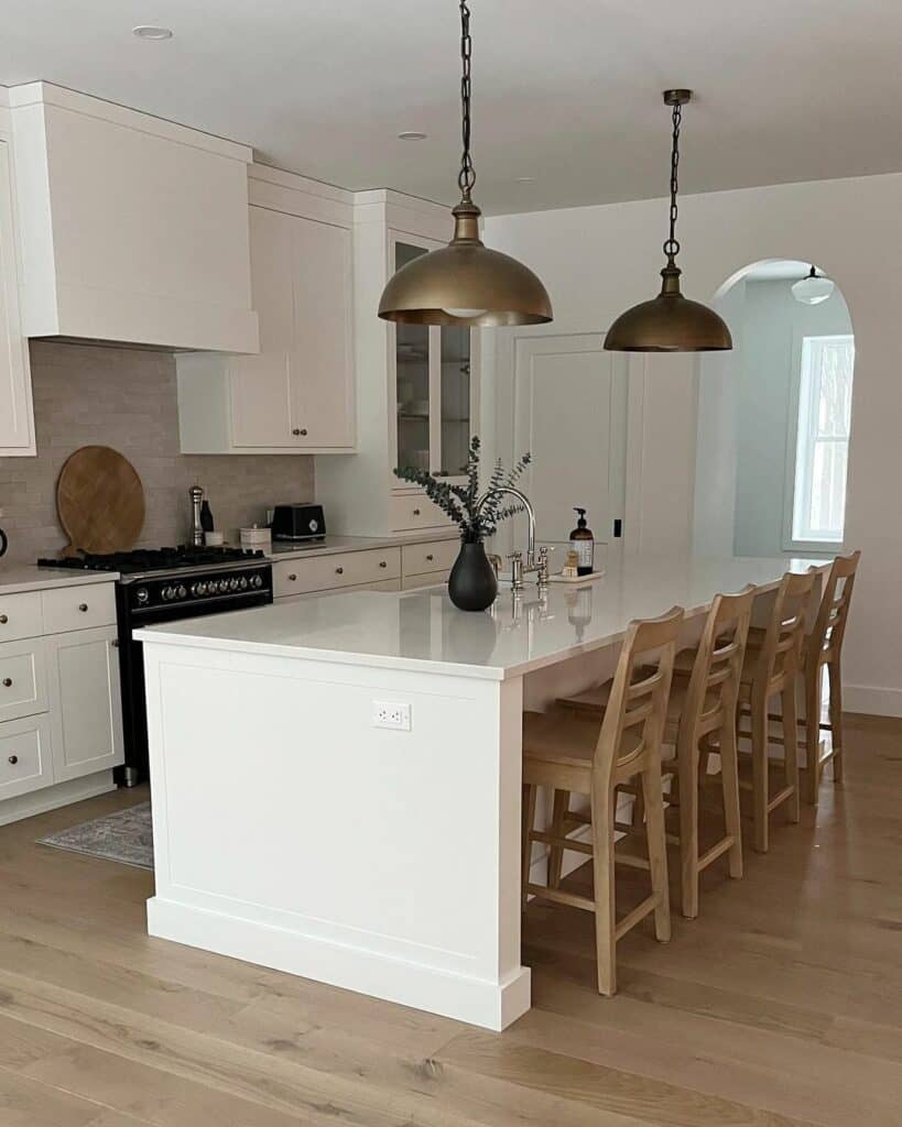 Brass Pendants Suspended Above a Spacious Island