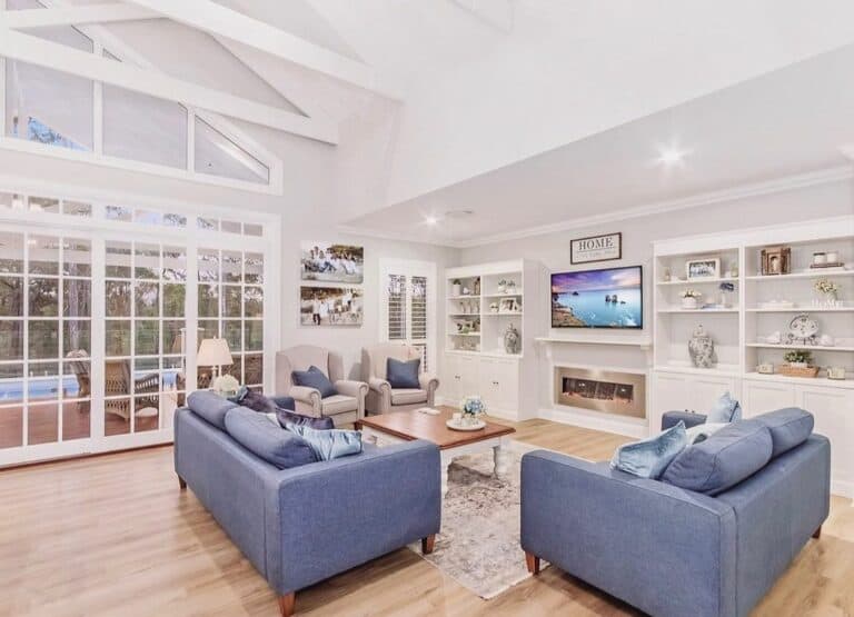 Bright Farmhouse Living Room With Two Blue Sofas