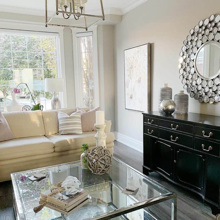 Bright Living Room Features Glass Coffee Table