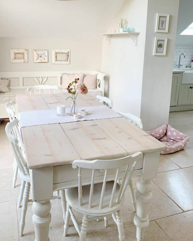 Bright White Neutral Dining Space With Pink Décor Accents