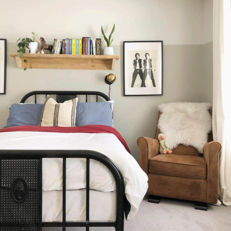Brown Armchair Beside a Black Bed Frame