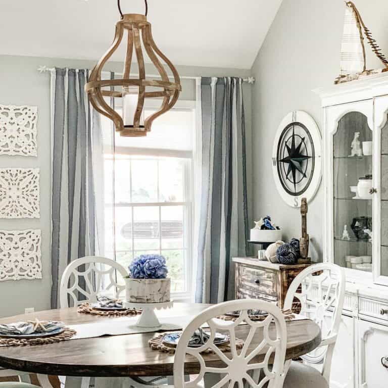 Coastal Dining Room With Gray Drapes