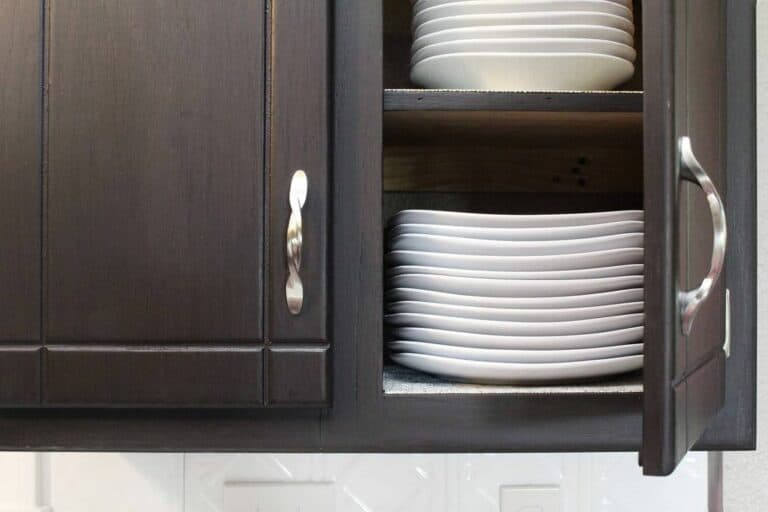 Dark Cabinet With White Crockery