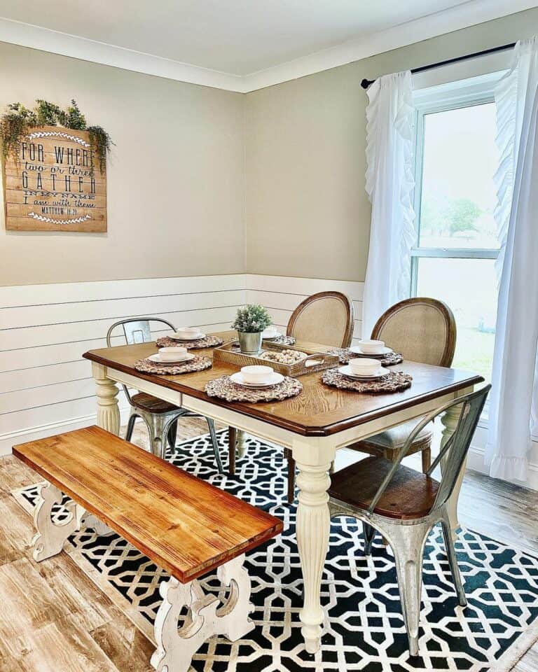 Dining Room With White and Black Area Rug