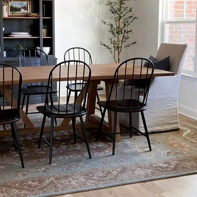 Dining Room With an Ornate Brown and Gray Rug