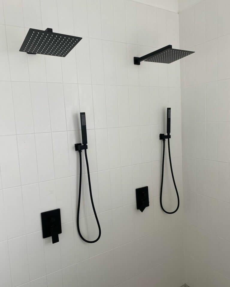 Double Black Shower Heads on Vertical Subway Tile