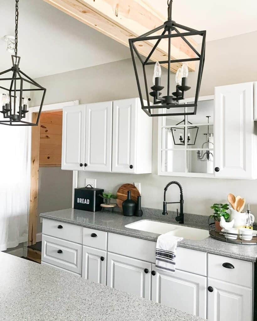 Exposed Wood Beam Over White Cabinets