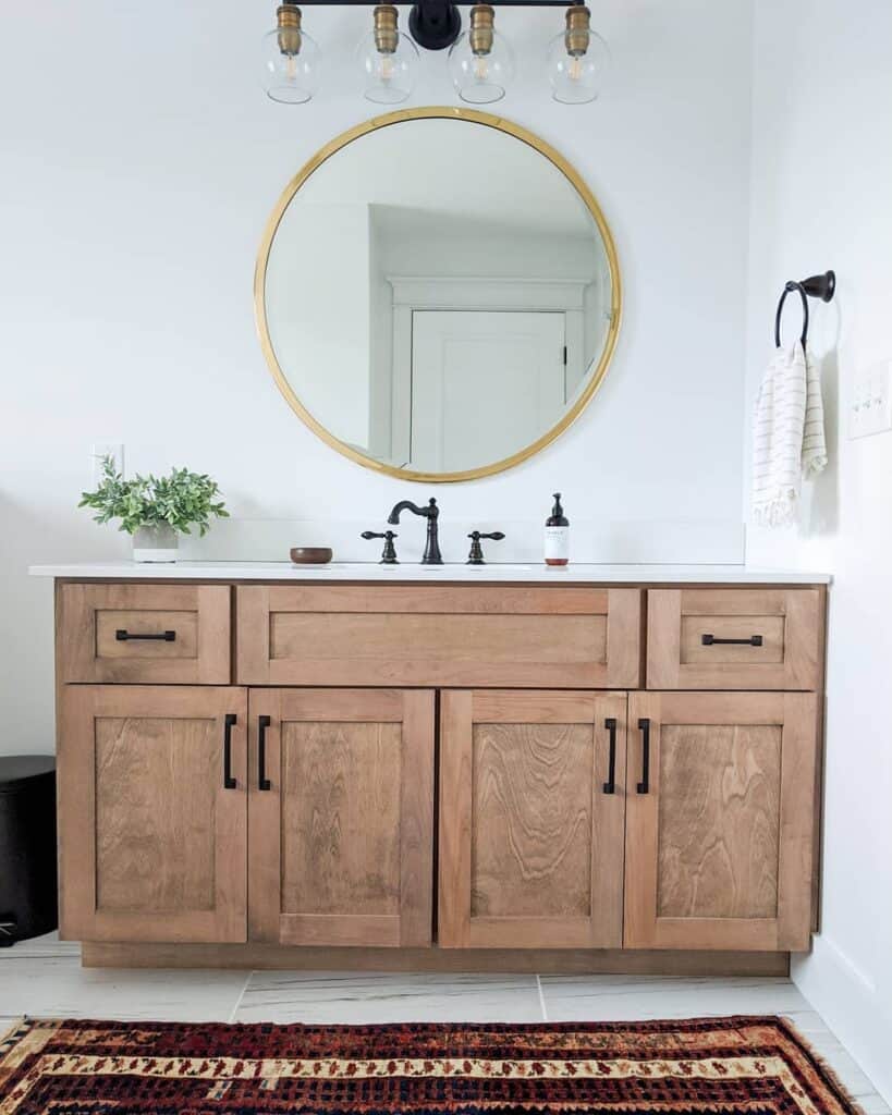 Farmhouse Bathroom With Gold Framed Mirror