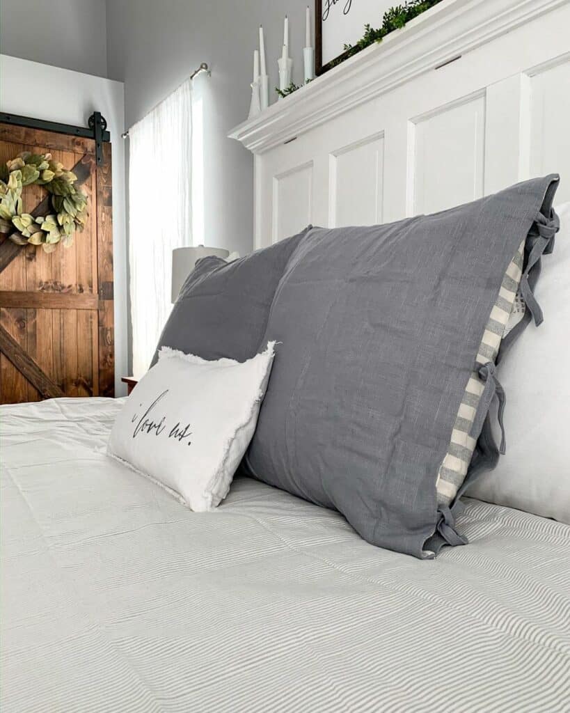Farmhouse Bed With White and Gray Bedding