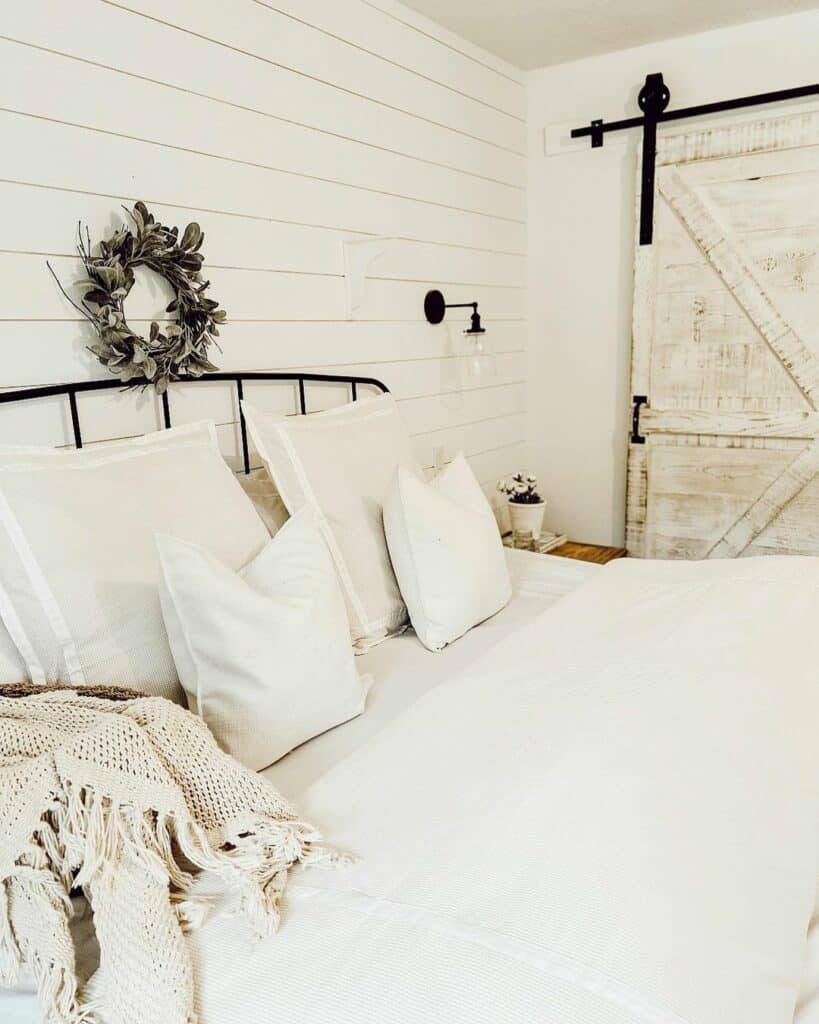 Farmhouse Bedroom With Beige Shiplap Accent Wall