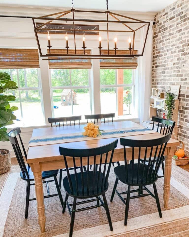 Farmhouse Dining Room With Red Brick Wall