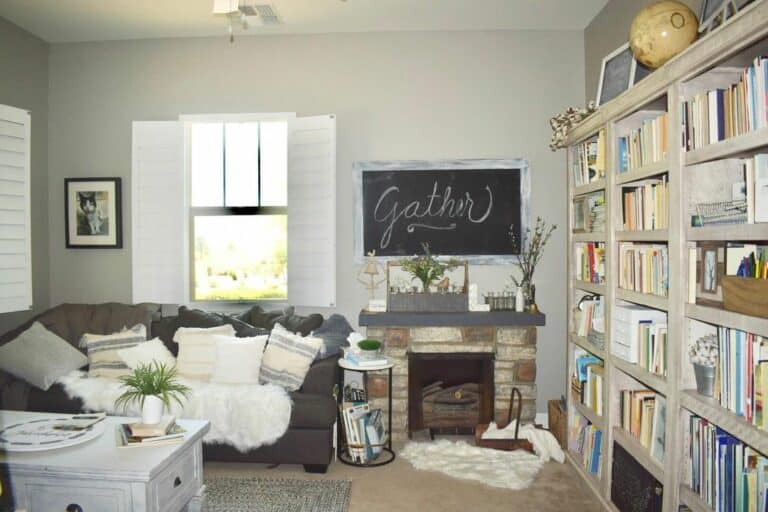Farmhouse Reading Room With Beige Bookshelves