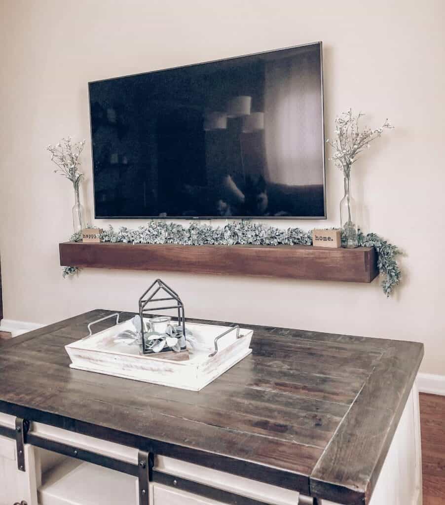 Flatscreen TV With Stained Wood Floating Shelf
