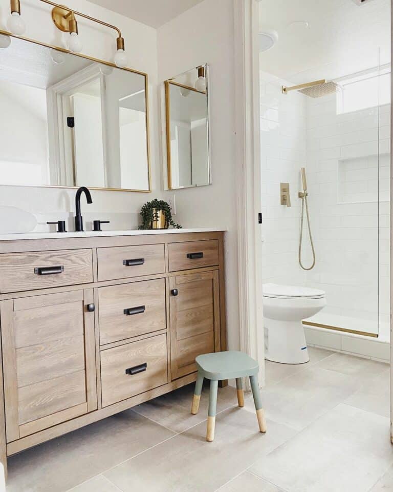 Gold Fixtures for a Modern White Farmhouse Bathroom Shower