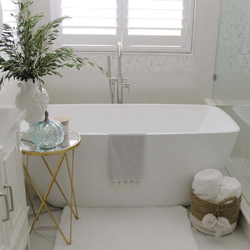 Gold Mirrored Side Table in White Bathroom