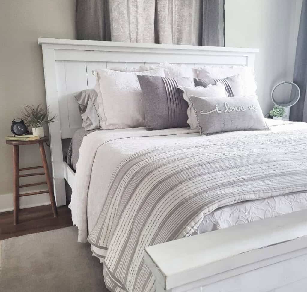 Gray Farmhouse Bedroom With White Bed