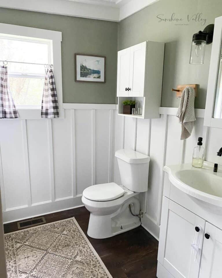 Green Bathroom With White Board and Batten Wainscoting