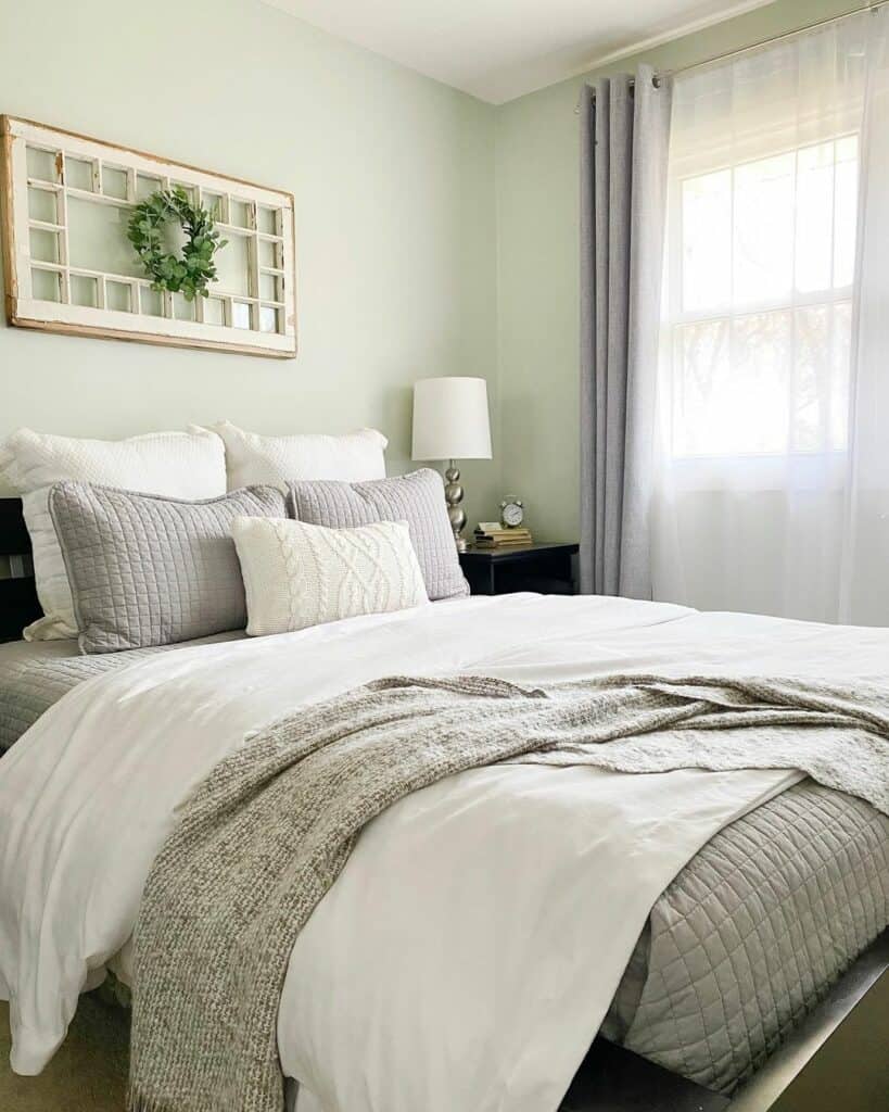 Green Bedroom With White and Gray Bed